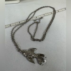 Long silvertone fish necklace with rhinestones